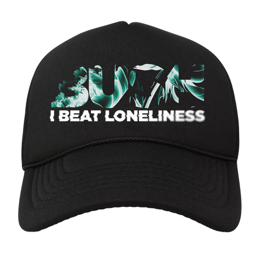 A classic black trucker hat with Bush's new album title "I Beat Loneliness" printed across the front.