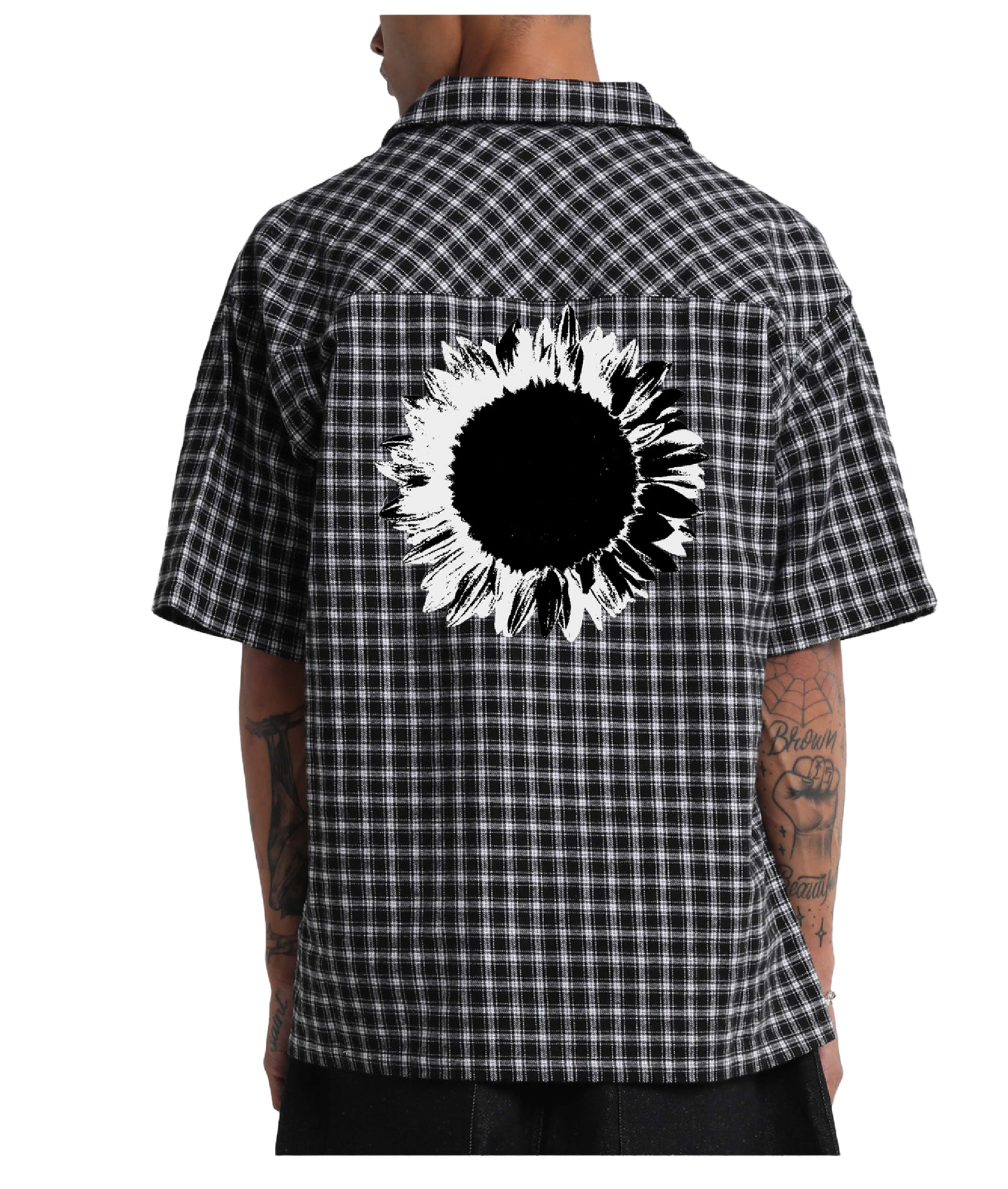 Black and white checkered shirt with a sunflower design on the back, worn by a person.